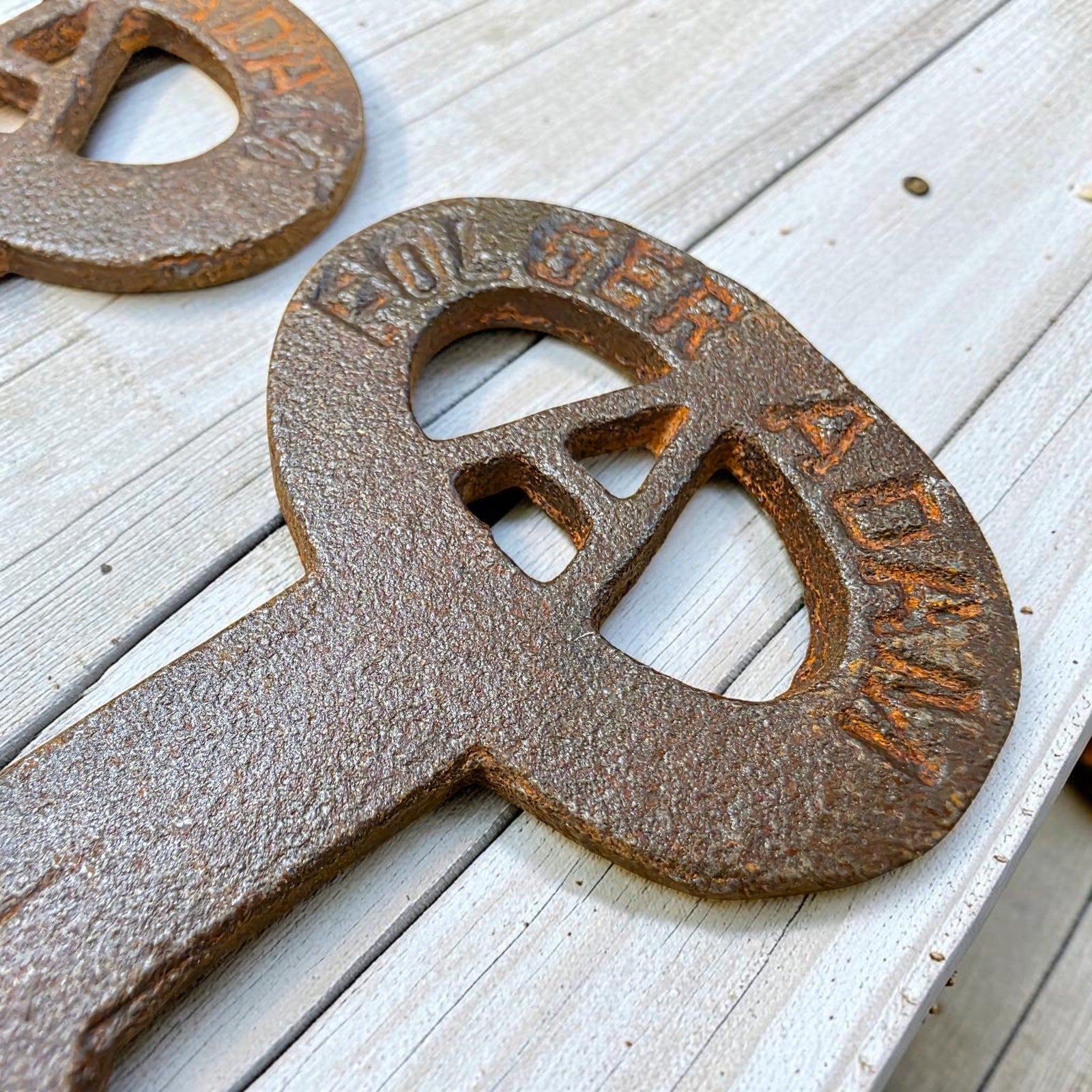 Jones Peak Folger Adams cast iron keys detail view with antique finish and embossed lettering.