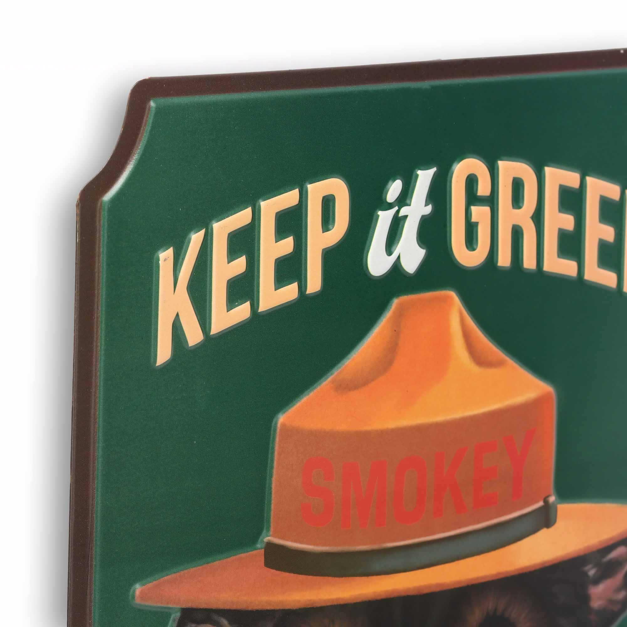 Close-up of the raised Smokey Bear artwork and Keep It Green message
