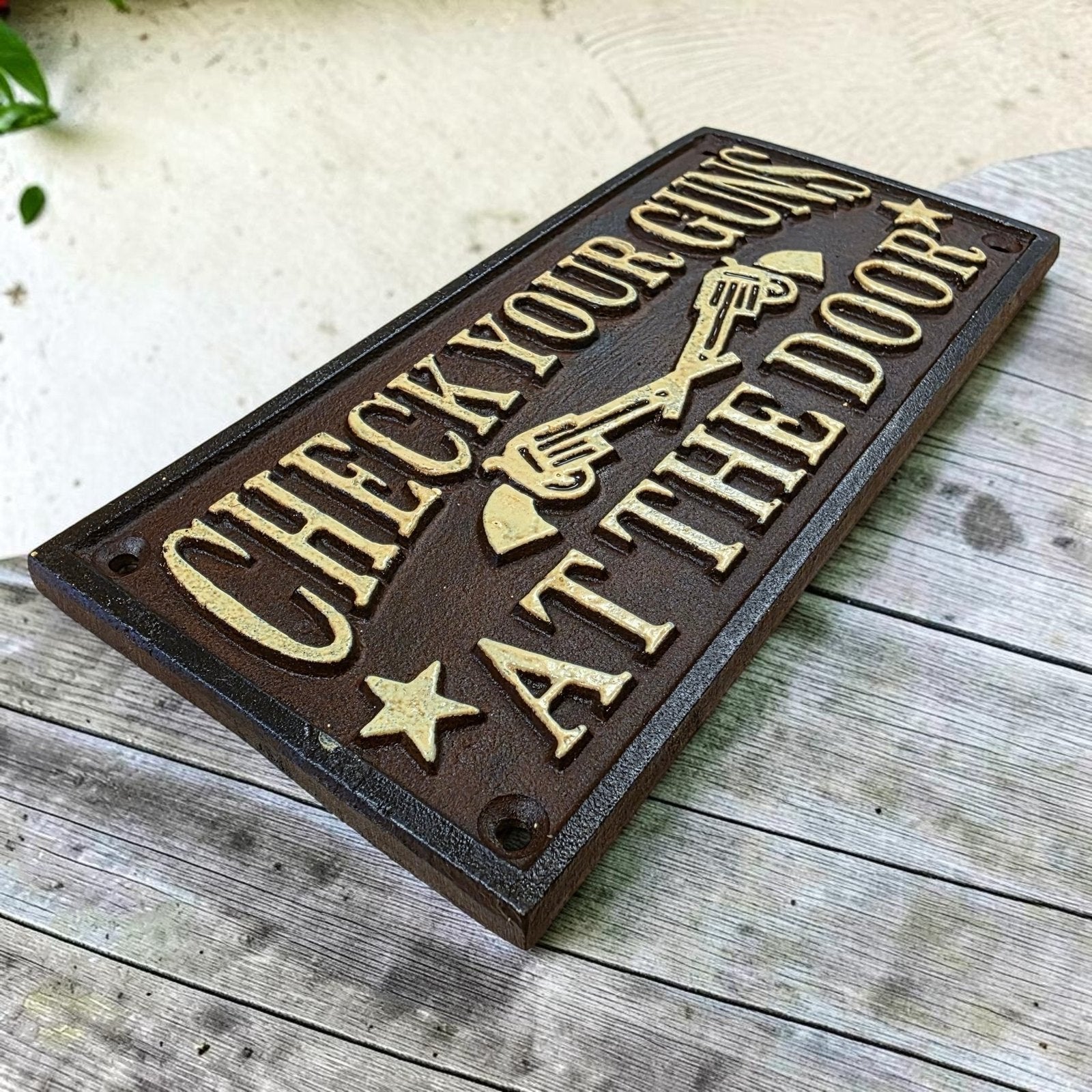 Check Your Guns At The Door Cast Iron Wall Plaque Sign With Antique Finish (7.75" x 3.5") - Jones Peak