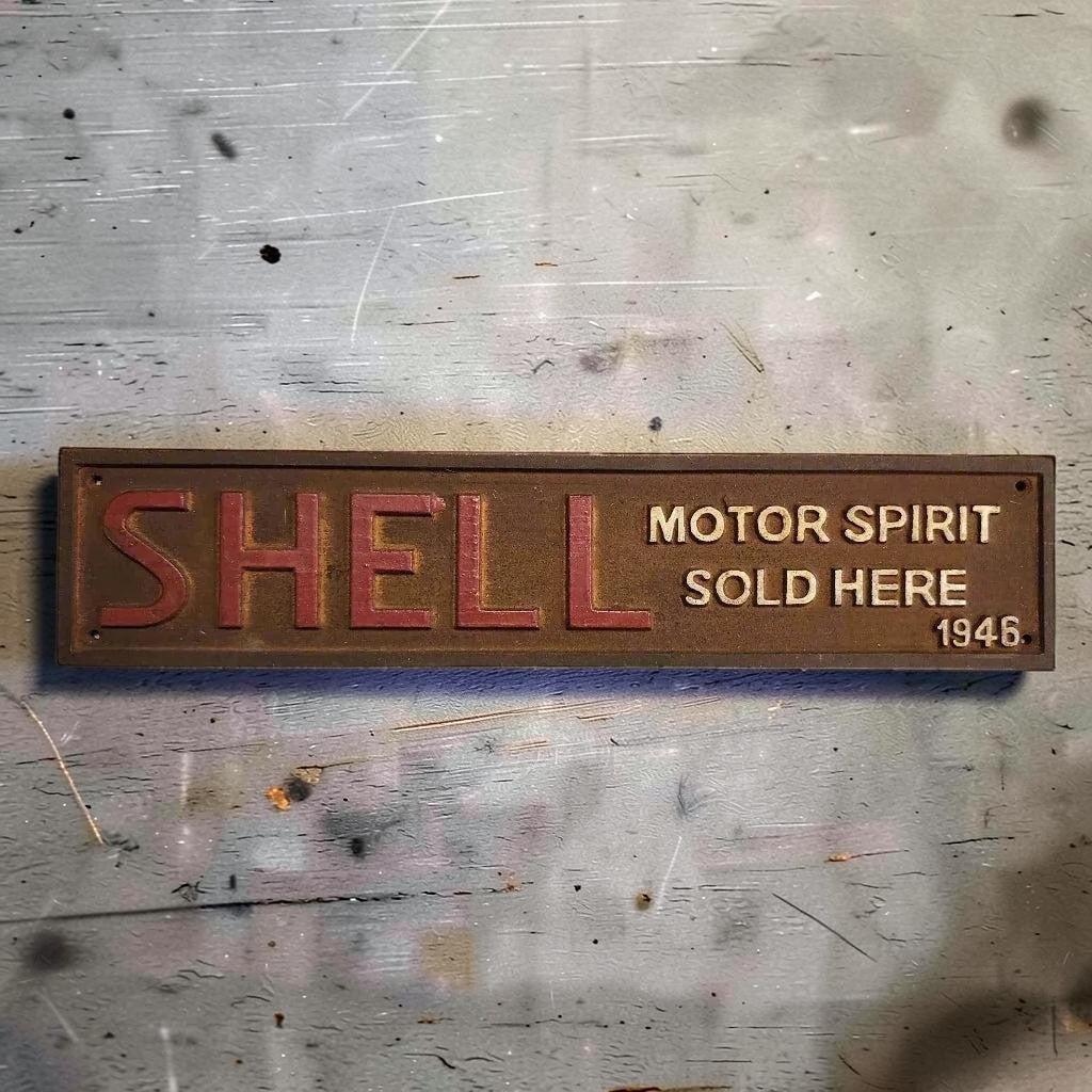 Shell 1946 Cast Iron Embossed Plaque With Painted Antique Finish (13.25" x 3") - Jones Peak