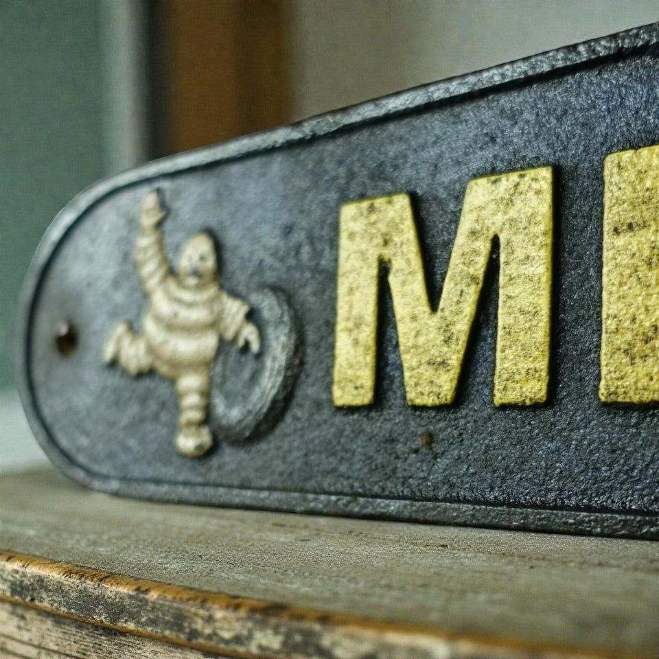 Tire Man Cast Iron Plaque With A Distressed Antique Hand Painted Finish (19.5" x 3.5") - Jones Peak