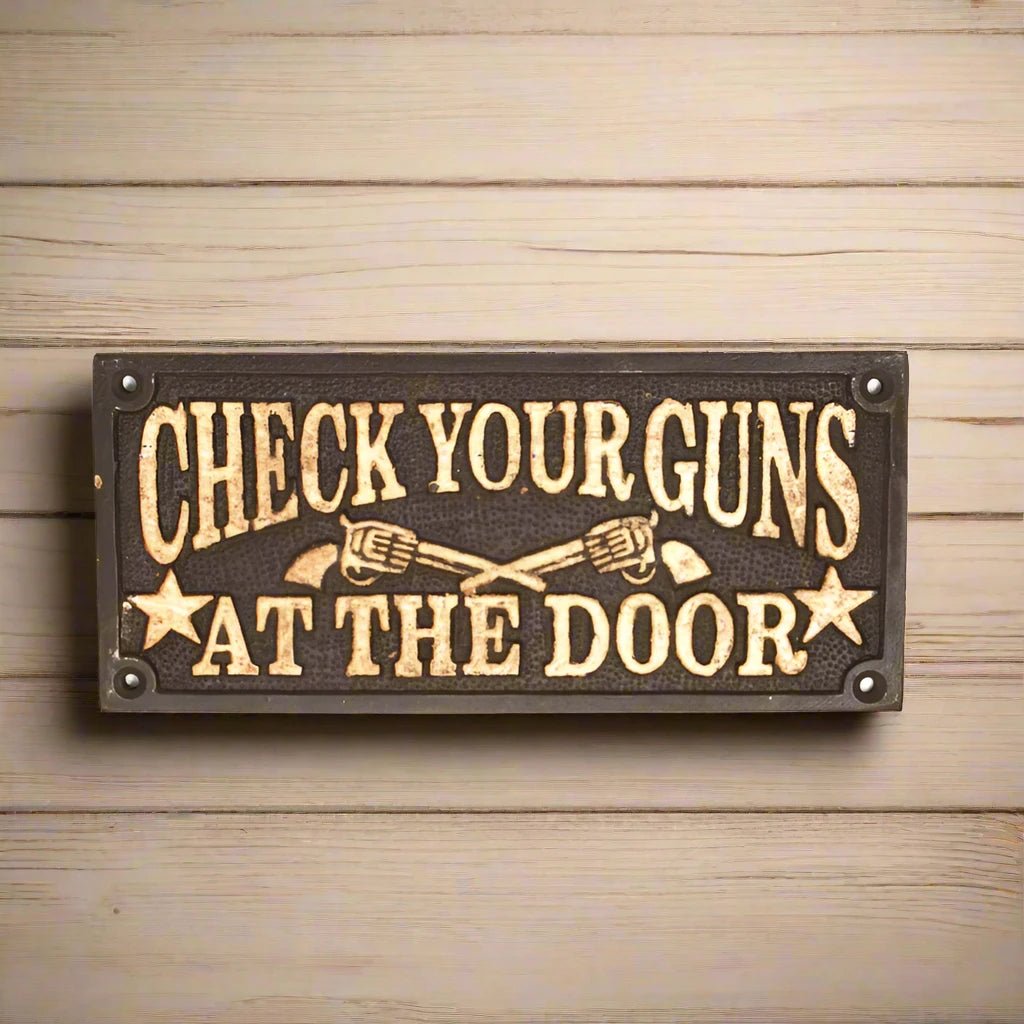 Check Your Guns At The Door Cast Iron Wall Plaque Sign With Antique Finish (7.75" x 3.5") - Jones Peak
