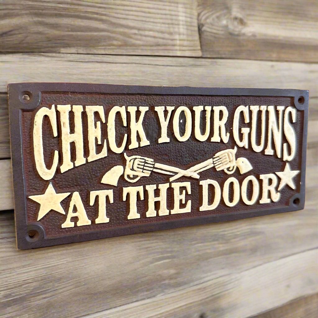 Check Your Guns At The Door Cast Iron Wall Plaque Sign With Antique Finish (7.75" x 3.5") - Jones Peak