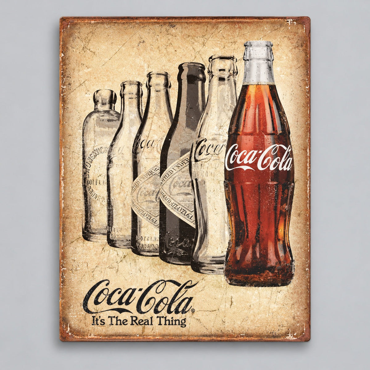 Coca-Cola The Real Thing Metal Sign on a soft gray background