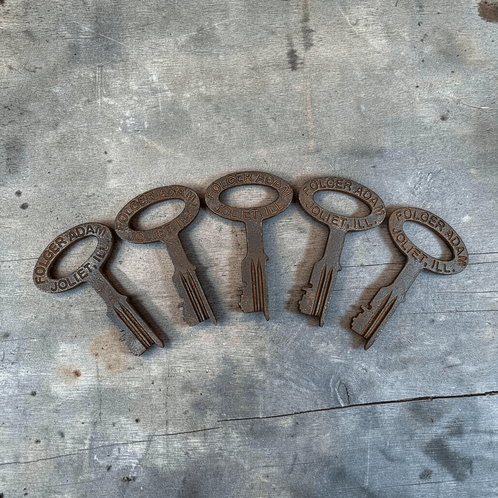 Jones Peak set of five antique-style cast iron jailhouse keys with distressed finish and Folger Adam Joliet lettering