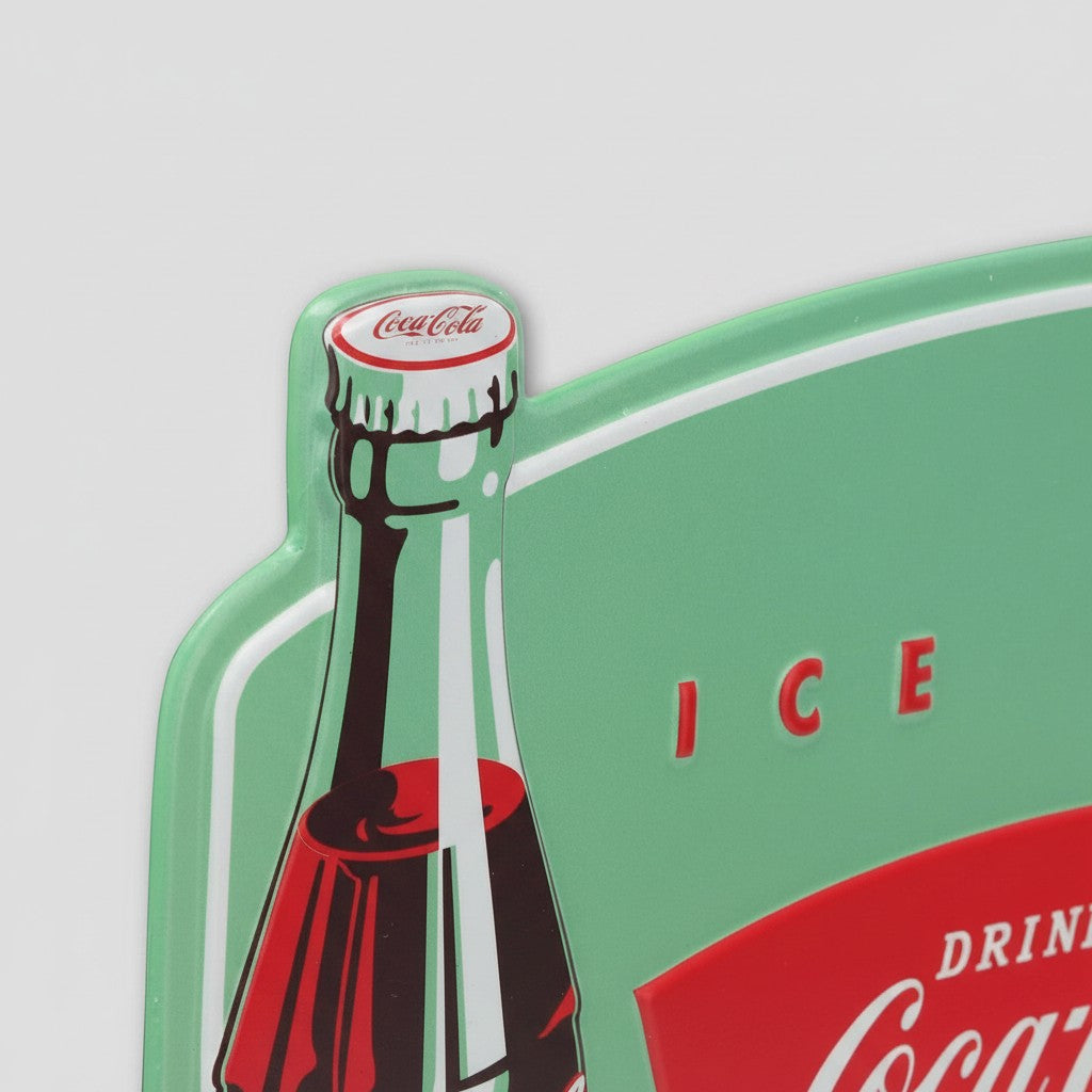 Jones Peak embossed metal Coca-Cola wall thermometer featuring vintage green bottle graphics and red branding