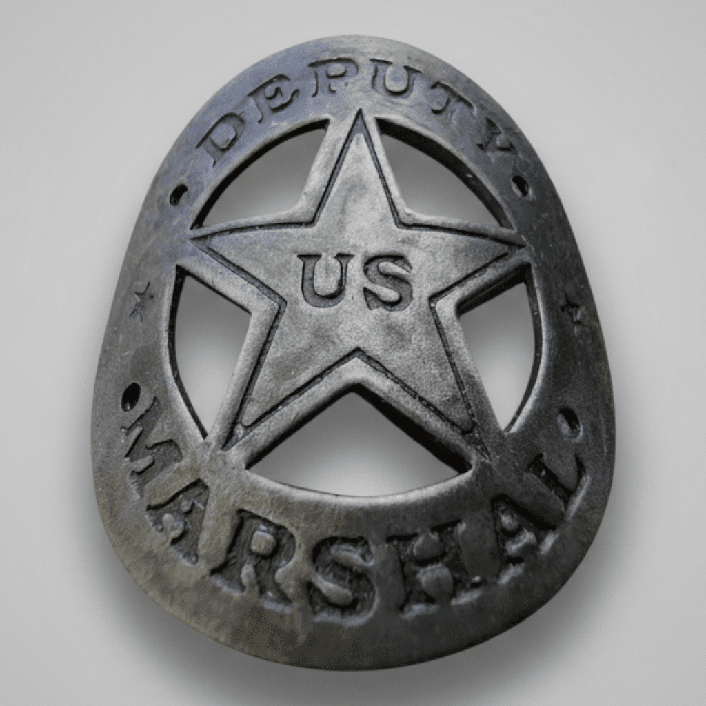 Jones Peak antique-finish solid metal Deputy Marshal gun butt tag with a star and US lettering for Western displays.