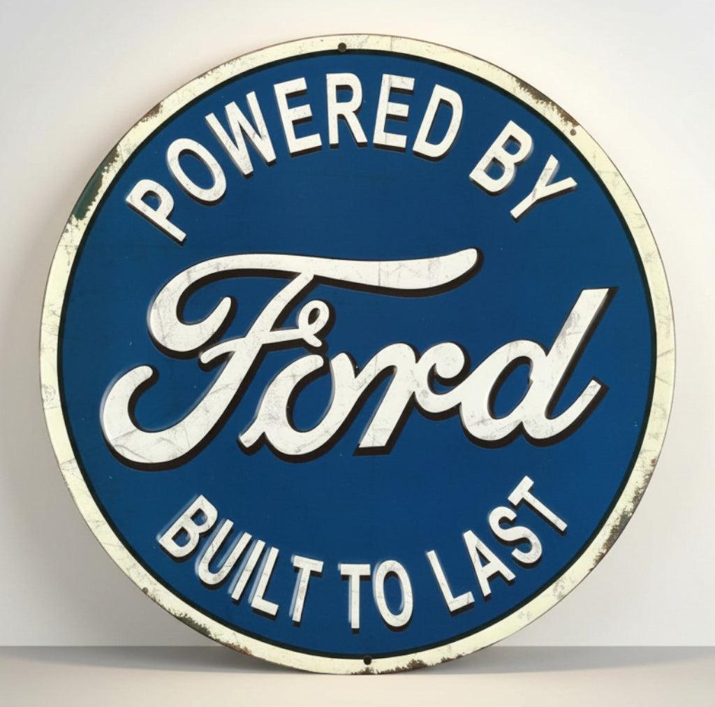 Jones Peak Ford Built To Last round embossed metal sign with blue background and white lettering.