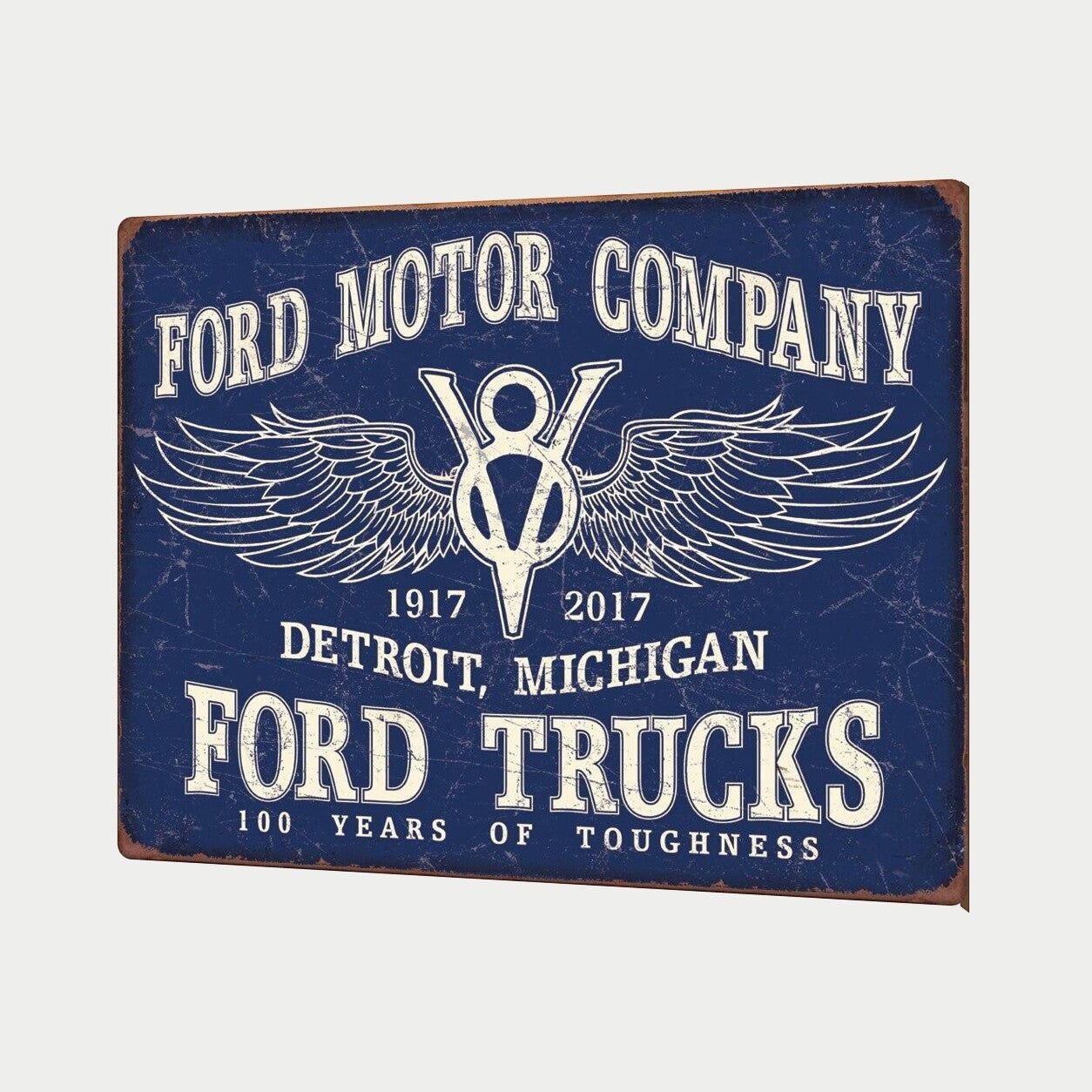 Jones Peak Ford Trucks 100 Years of Toughness vintage-style blue metal wall sign for garages and workshops.
