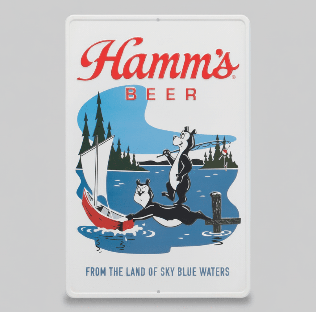 Jones Peak embossed metal sign featuring Hamm’s Beer logo, fishing bears, and a sailboat on a lake.
