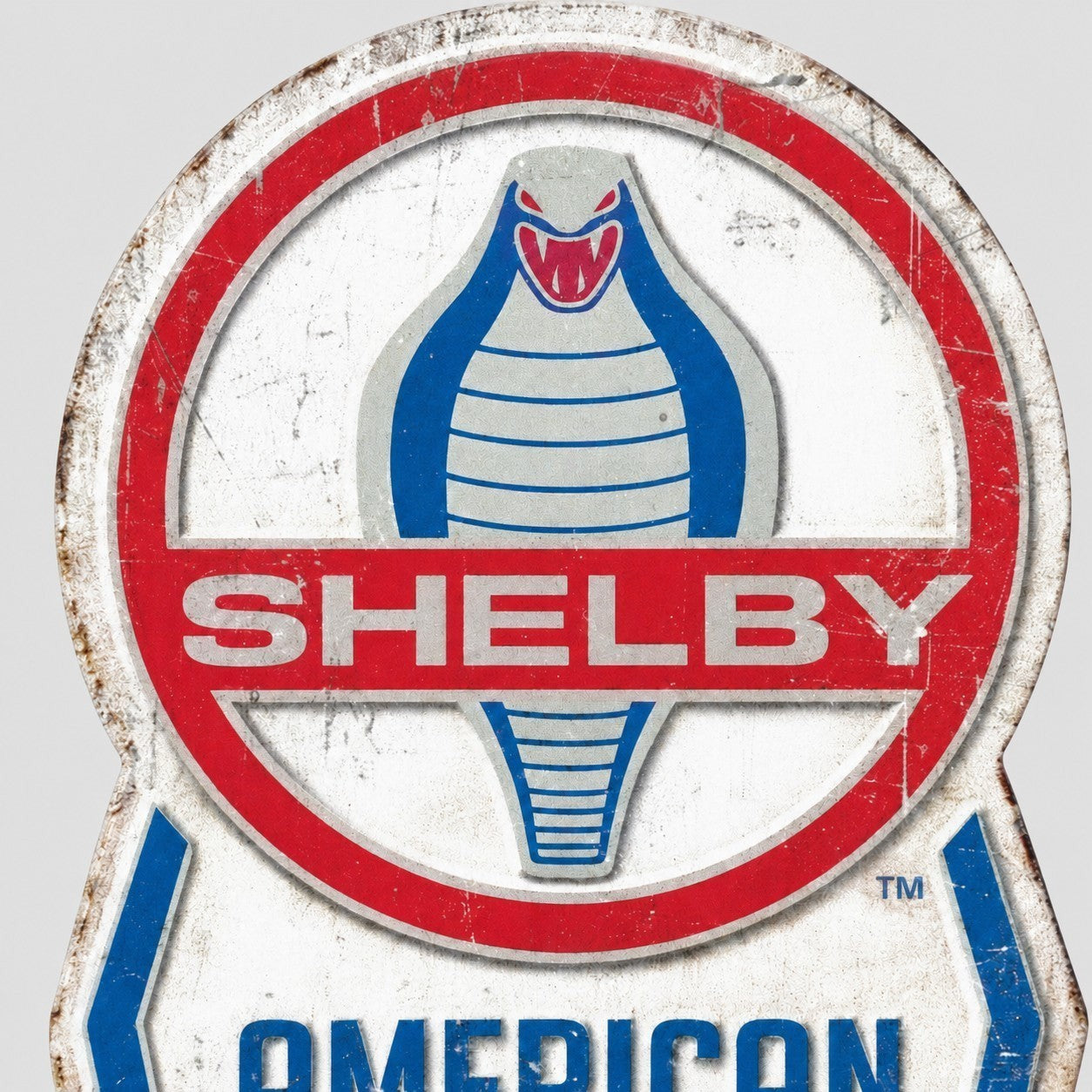 Jones Peak Shelby American embossed metal thermometer with vintage cobra logo and distressed finish for wall decor.