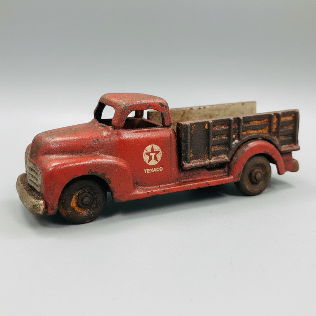 Jones Peak vintage-style red cast iron Texaco toy truck with an antique hand-painted finish and moving wheels.