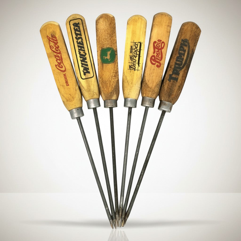 Jones Peak vintage ice pick set with six hardwood handles featuring Coca-Cola, Winchester, John Deere, Dr Pepper, Pepsi, and Triumph logos.