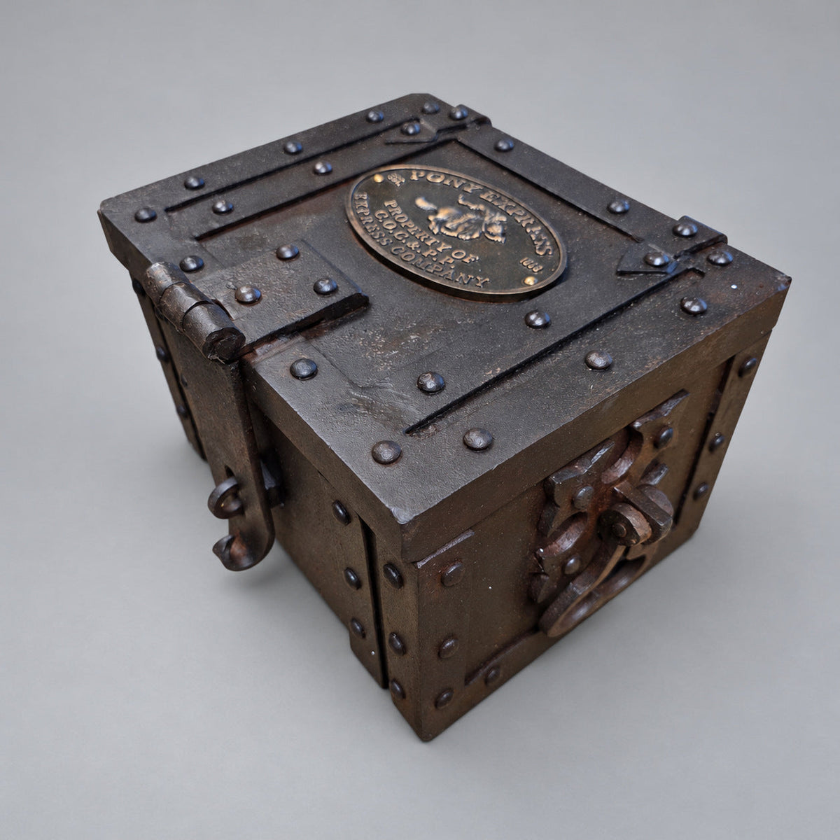 Pony Express cast iron strong box, current design, angled view 1 on a soft gray background