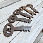 Jones Peak Folger Adams set of five cast iron keys showing distressed antique finish details.
