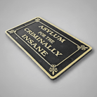 Jones Peak cast iron plaque with Asylum for the Criminally Insane text in an antique finish and gothic style