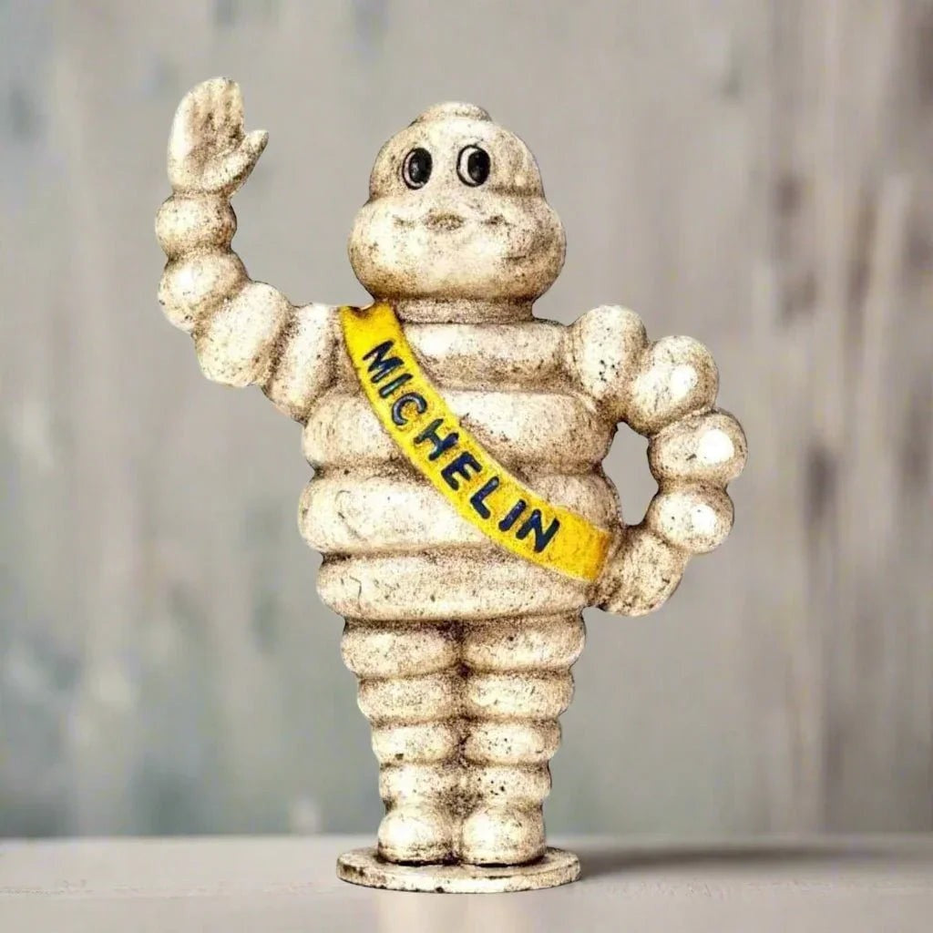 Michelin Man 1889 small cast iron coin bank detail view - Jones Peak