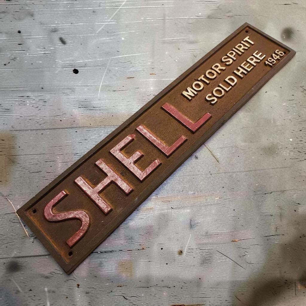 Shell 1946 Cast Iron Embossed Plaque With Painted Antique Finish (13.25" x 3") - Jones Peak