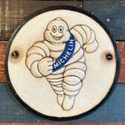 Tire Man Cast Iron Plaque With Painted Antique Finish (9.5 Round) - Jones Peak