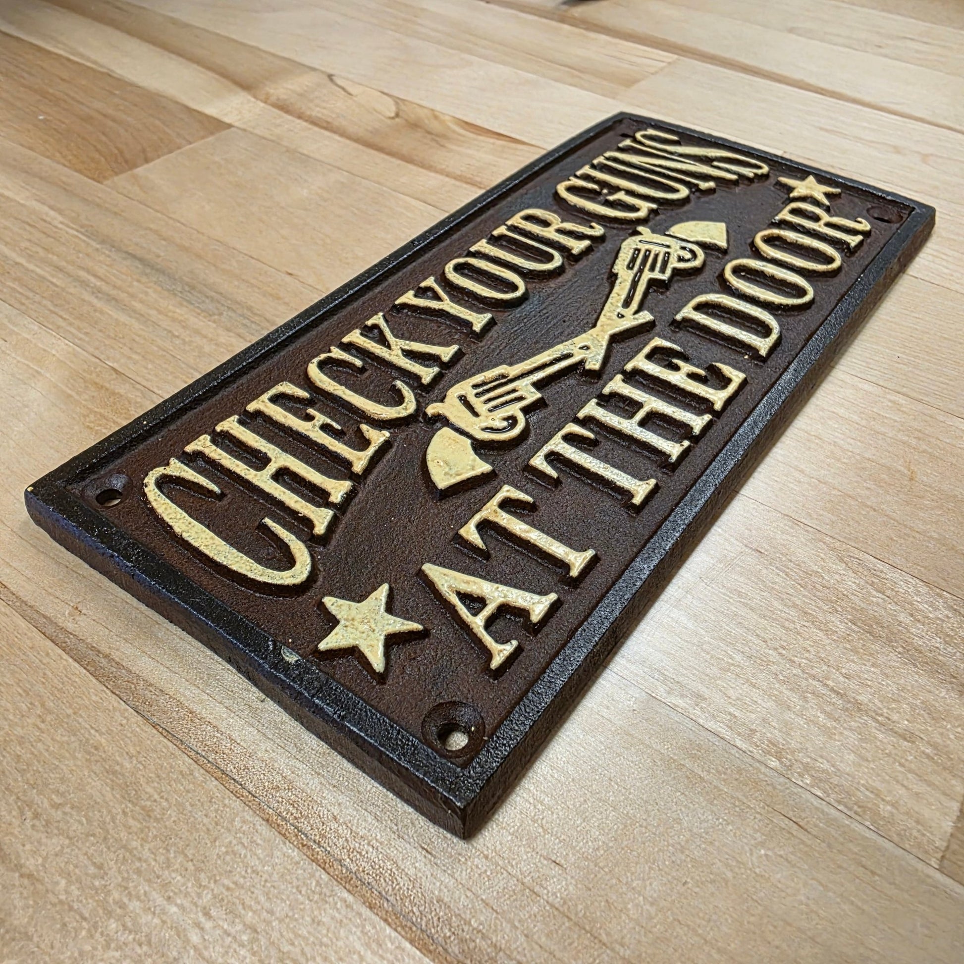 Check Your Guns At The Door Cast Iron Wall Plaque Sign With Antique Finish (7.75" x 3.5") - Jones Peak