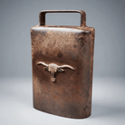 Jones Peak rustic cast iron cow bell with an antique patina finish and a decorative steer head emblem.