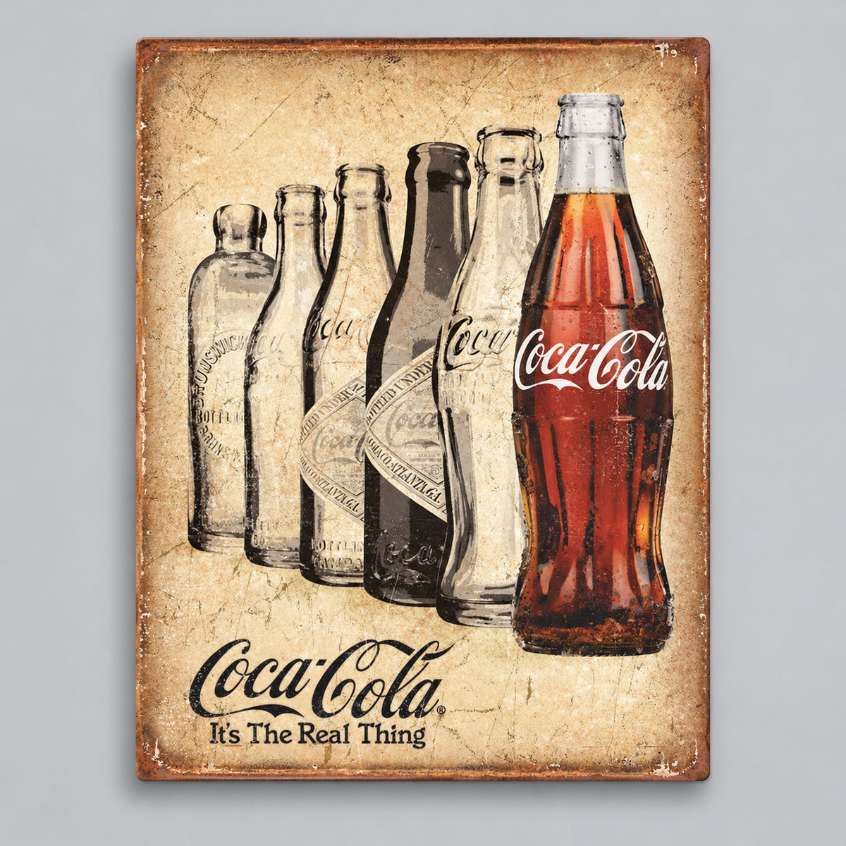 Coca-Cola The Real Thing Metal Sign on a soft gray background