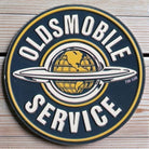 Oldsmobile Service Round Embossed Metal Magnet detail view
