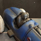 Jones Peak blue cast iron toy racer car with antique patina finish and moving details.