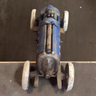 Jones Peak blue cast iron toy racer car with white wheels and antique patina finish. Moving details.
