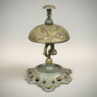 Jones Peak butterfly engraved solid brass hotel desk bell on stand with hand-antiqued patina.