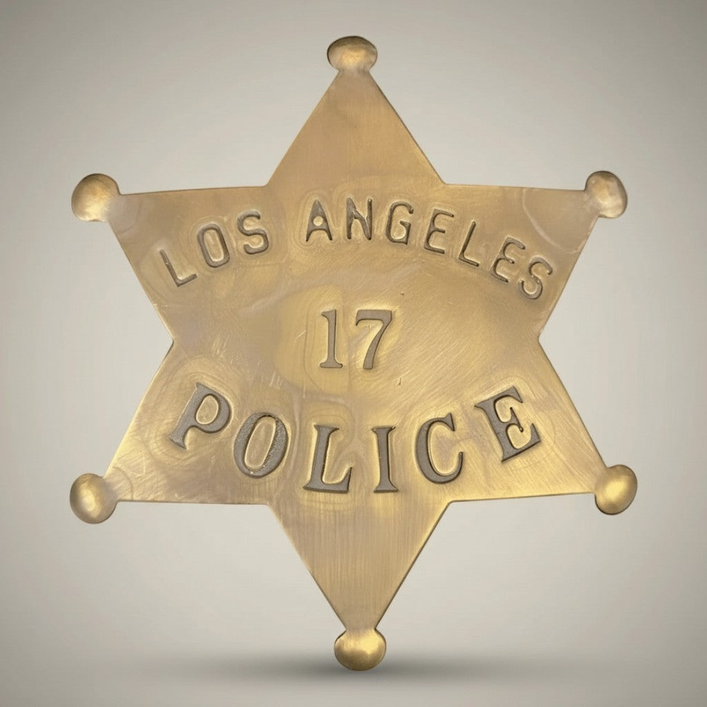 Jones Peak 1920s solid brass star badge with 'Los Angeles Police 17' embossed.