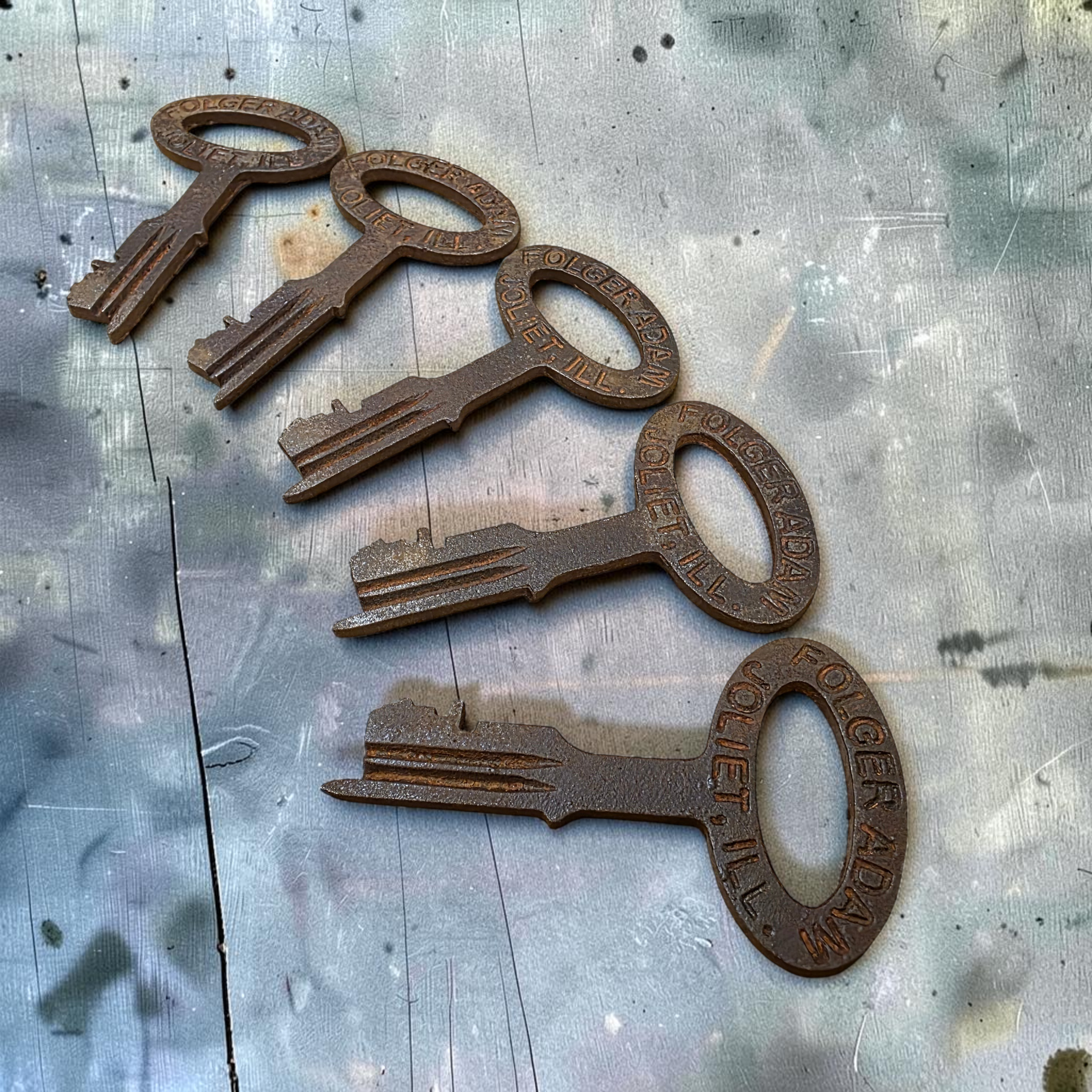 Jones Peak set of 5 cast iron jailhouse keys with distressed antique finish and Folger Adam Joliet lettering