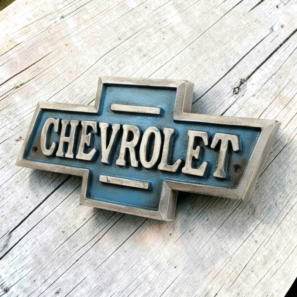 Jones Peak 1911 Chevrolet cast iron embossed plaque with blue and silver antique finish.