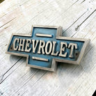 Jones Peak 1911 Chevrolet cast iron embossed plaque with blue and silver antique finish.
