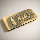 Jones Peak Coca-Cola St Louis World's Fair 1904 solid brass money clip with embossed bottle and text. Antique finish.