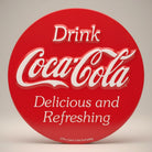 Jones Peak Coca-Cola embossed metal magnet, round red with white text, "Drink Coca-Cola Delicious and Refreshing"