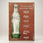 Jones Peak Coca-Cola Script Heritage Magnet featuring a vintage green bottle and evolution of the Coca-Cola logo.