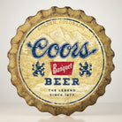 Coors Banquet weathered bottle cap metal sign with distressed beer logo artwork