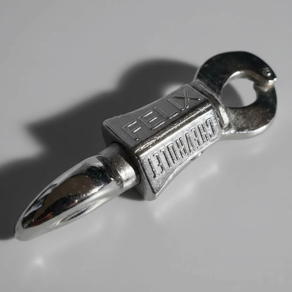 Jones Peak Felix Chevrolet chrome-plated copper mechanical key holder with an antique patina finish