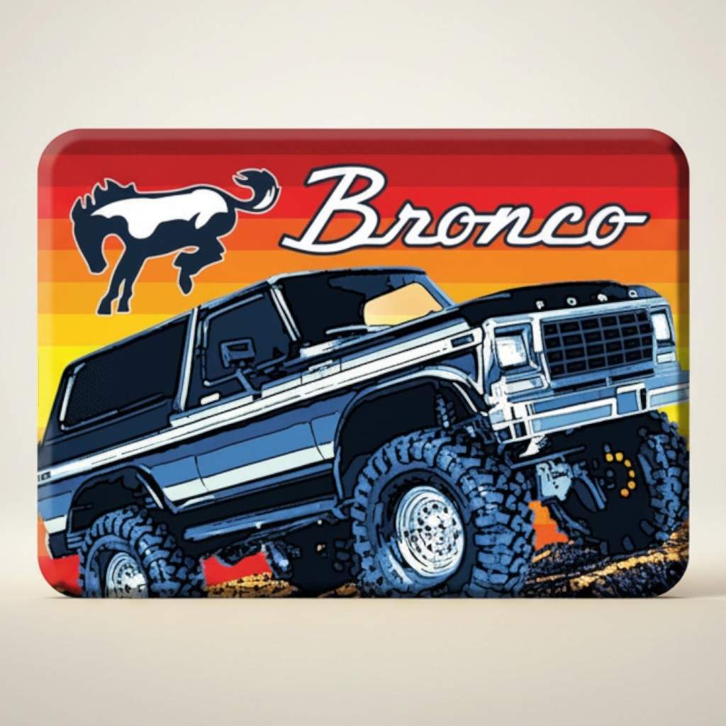 Jones Peak Ford Bronco retro magnet featuring a dark blue lifted Bronco with large tires on a colorful sunset background.
