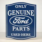 Jones Peak Ford Genuine Parts embossed metal magnet, dark blue with white lettering and Ford oval logo.