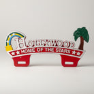Jones Peak Hollywood Home of the Stars license plate topper, red with white lettering, rainbow, and palm tree. Hardwood.