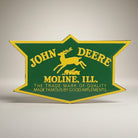 Jones Peak John Deere Badge Embossed Metal Magnet with yellow deer and text on green background.