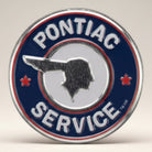 Jones Peak Pontiac Service round embossed metal magnet with red, white, and blue logo.