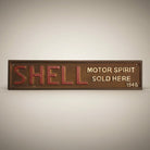Jones Peak Shell Motor Spirit Sold Here 1946 cast iron embossed plaque with red lettering and antique patina finish.