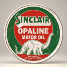 Jones Peak Sinclair Opaline Motor Oil metal sign with a dinosaur graphic. Red, green, and white.