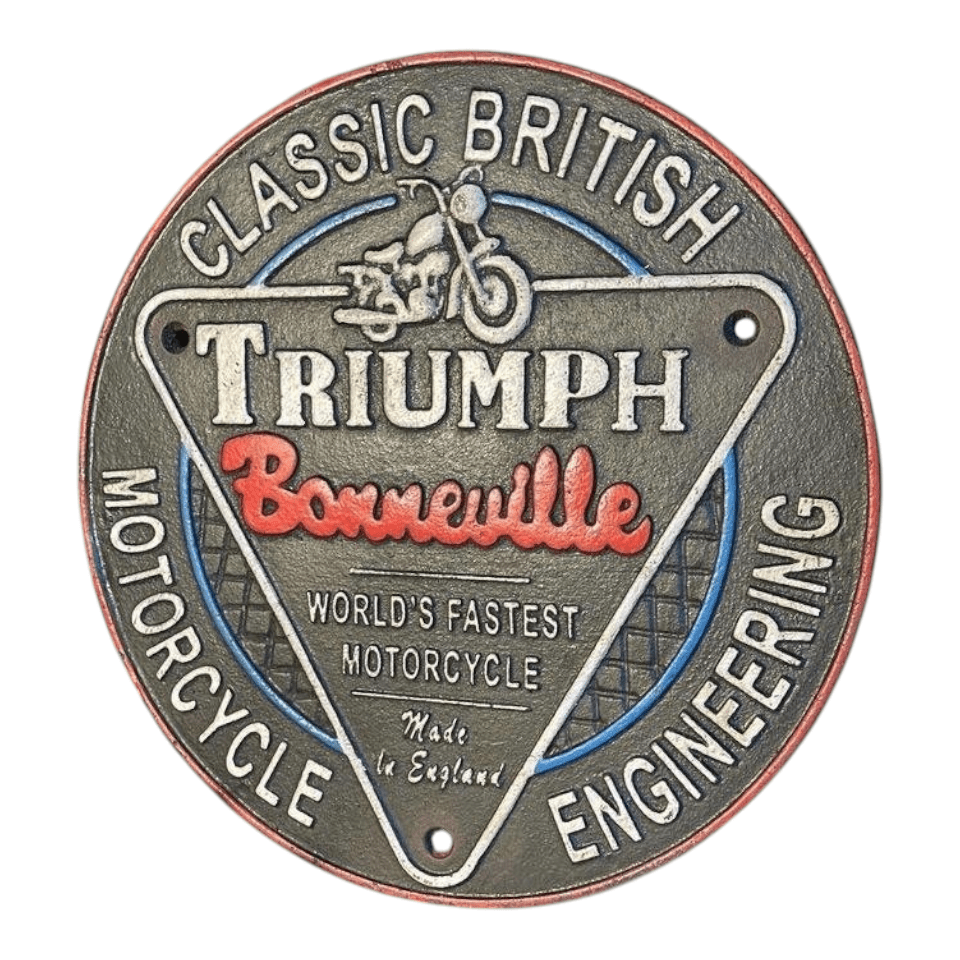 Jones Peak round cast iron Triumph Bonneville motorcycle plaque with hand-painted antique finish on a wooden shelf.