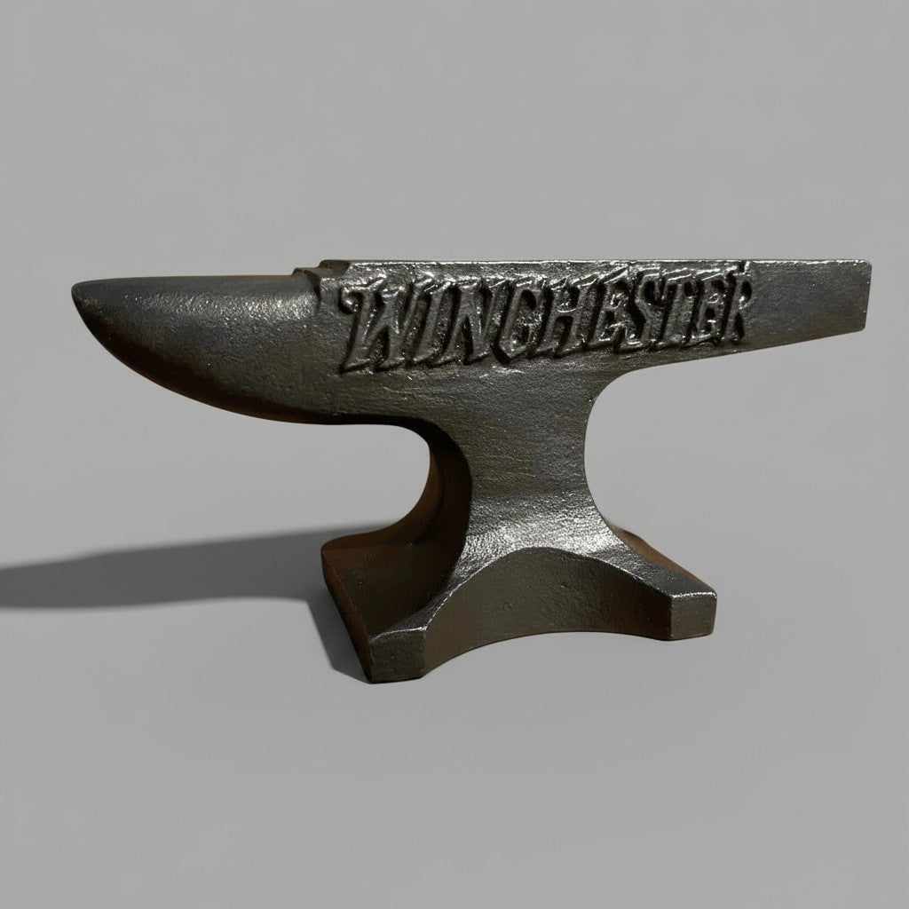 Jones Peak Winchester 1929 cast iron anvil paperweight with a hand-antiqued distressed finish for industrial decor.