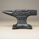 Jones Peak black cast iron anvil paperweight with Ford 1920 logo, antique finish, for desk or workshop.