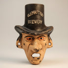 Jones Peak Warlock Brewery cast iron wall bottle opener shaped like a man in a top hat with a distressed, vintage look.